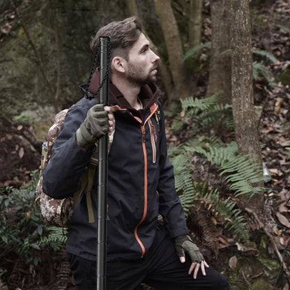 Terozi heavy-duty staff being used for stability on a rugged, muddy alpine trail, providing essential joint support for hikers with bad knees.